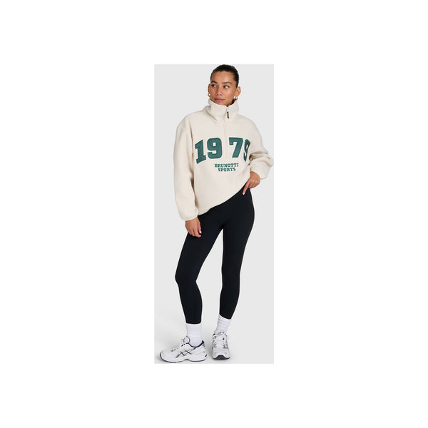 Crèmekleurige sweater met groene '1970'print en zwarte legging sportoutfit voor dames