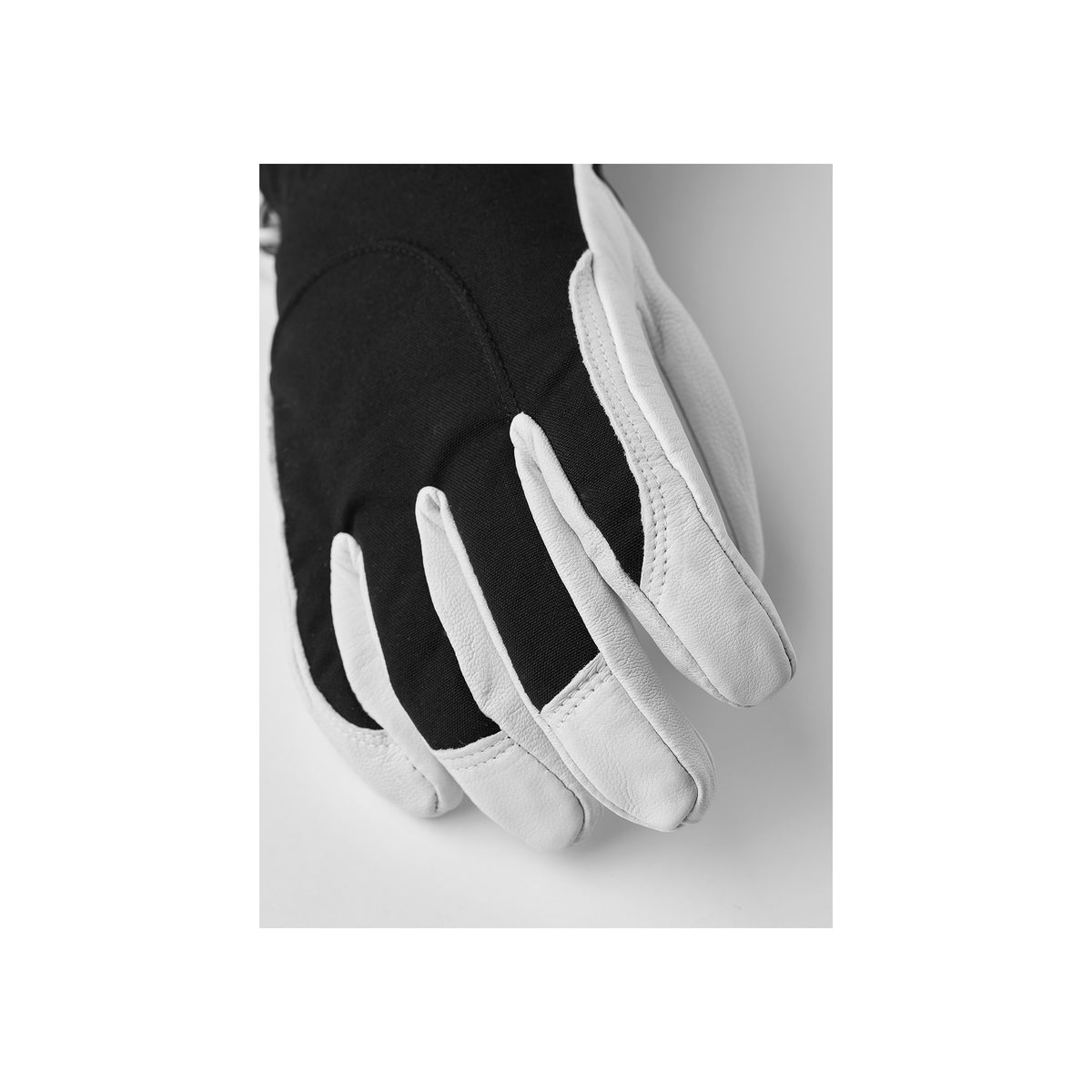 Zwart-witte werkhandschoenen met leren palm en flexibele vingers voor optimale grip en comfort
