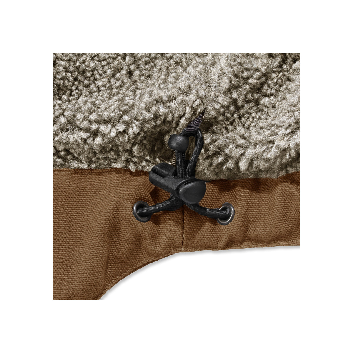 Close-up van bruine koord stopper met teddy fleece voering, verstelbare trekkoord detail op jas of vest