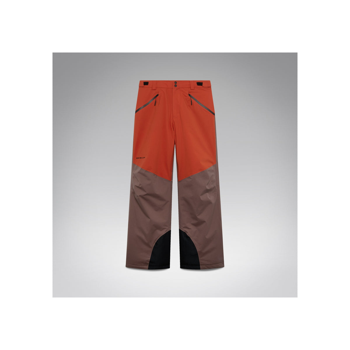 Oranje-bruine ski-broek met versterkte knieën en waterdichte bescherming voor wintersport