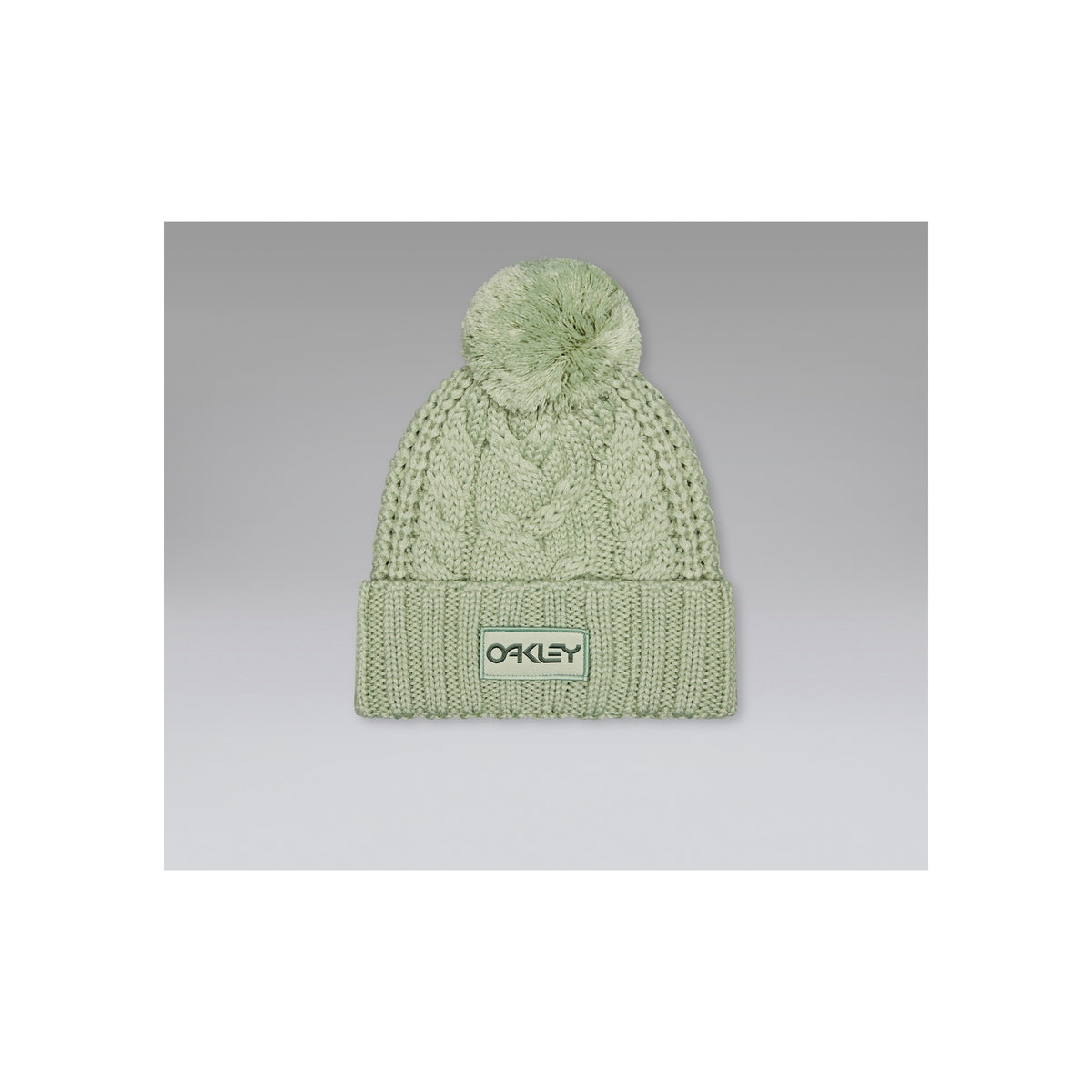 Oakley gebreide muts met pompon in lichtgroen - wintermuts met logo label