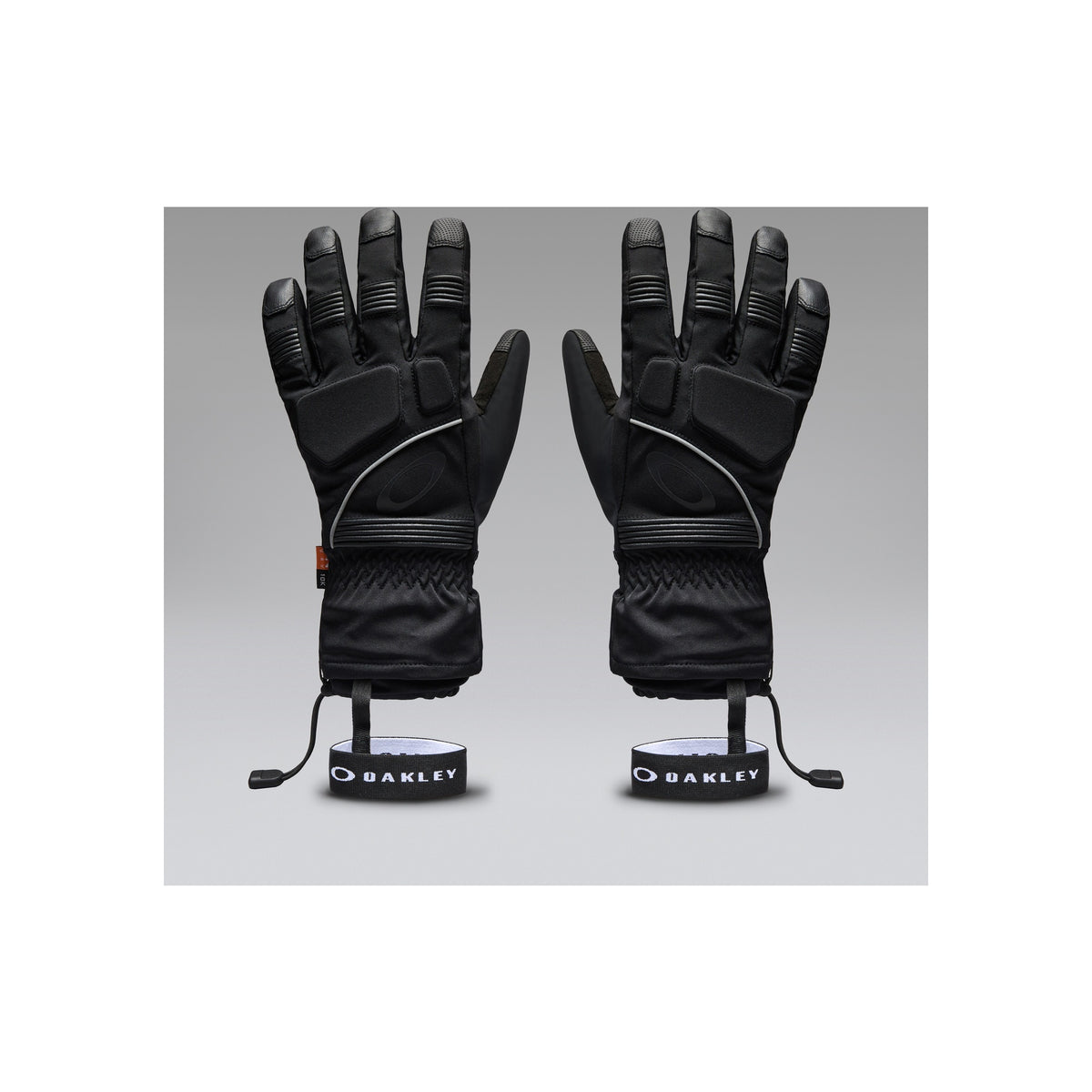 Oakley zwarte ski handschoenen met reflecterende details en polsriempjes, vooraanzicht paar