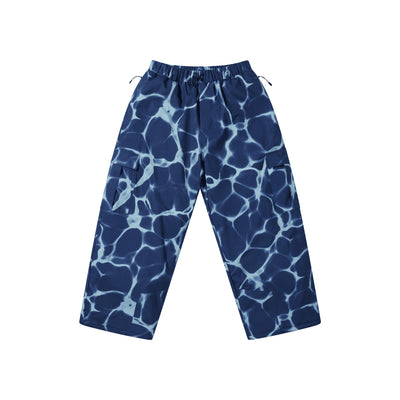 Blauwe kinderbroek met wit bliksemschicht patroon, elastische tailleband, losse pasvorm