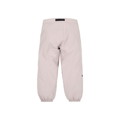 Lichtroze baby legging met knoopdetail op de knie en comfortabele pasvorm