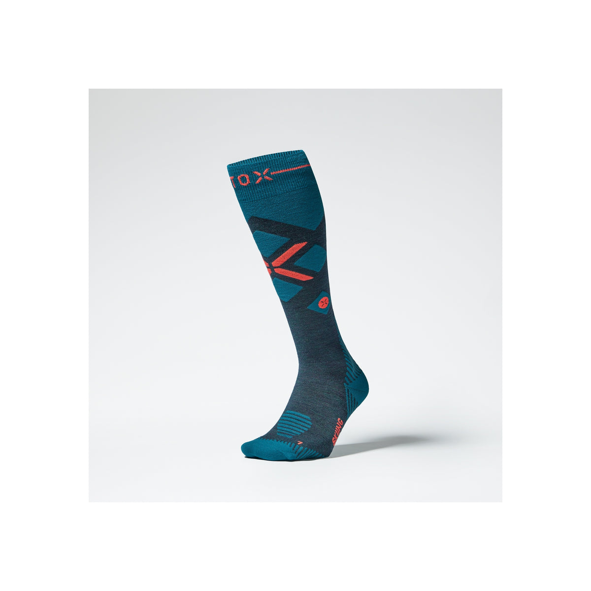 Donkerblauwe compressiekousen met turquoise en rode accenten voor sportieve prestaties