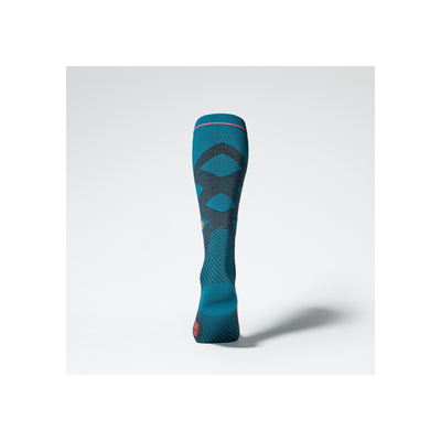 Blauwe compressiekousen met anatomisch patroon en grijze accenten, achterkant weergave