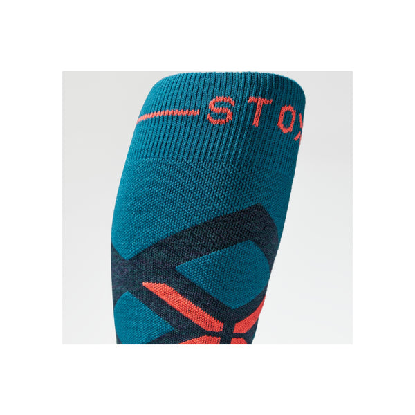 Blauwe compressiesok met rood STOX logo en steunzones voor sportprestaties
